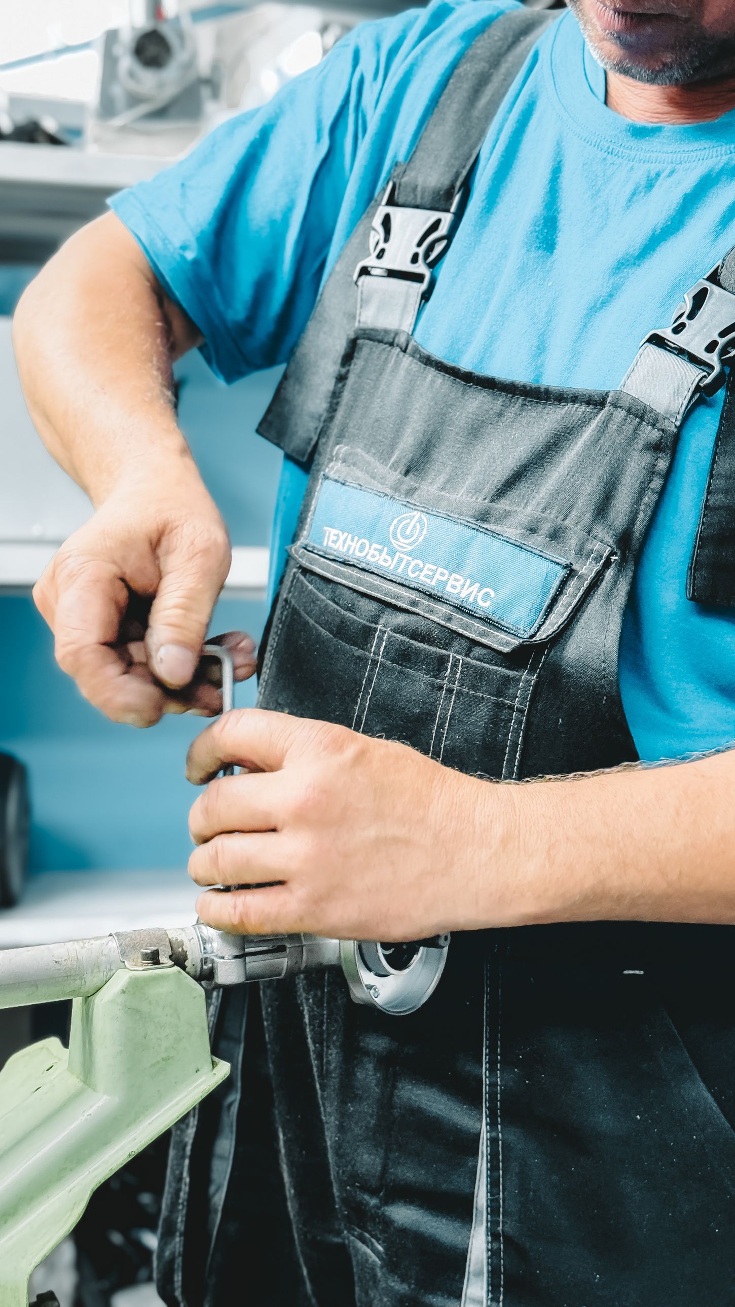 A plumbing professional carefully repairing a pipe fitting